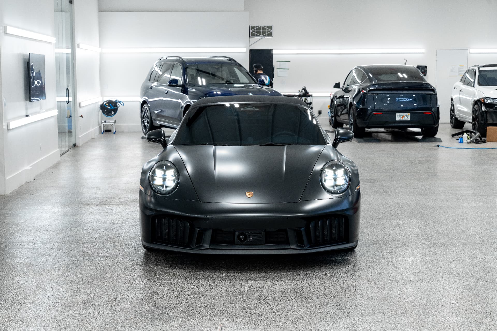 Black Porsche 911 in the Detailers of Naples installation studio